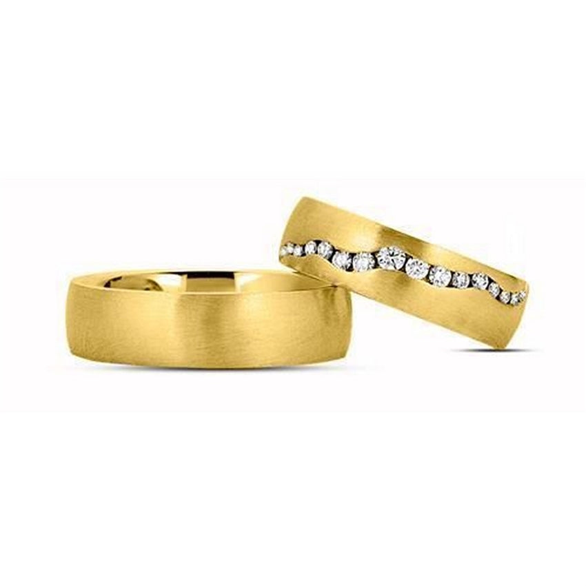 Eksklusive Nuran vielsesringe i 14 karat silkemat guld med 16 diamanter i kanal fatning.